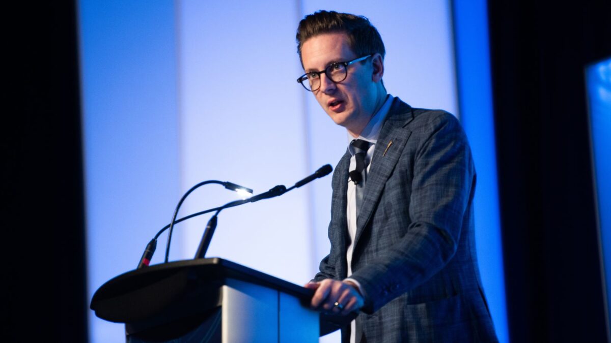 Nate Glubish Nate Glubish, Alberta's Minister of Technology and Innovation, speaking at Spartan Controls' "Experience Industrial Innovation" conference in May 2026. - Photo by ROOTED